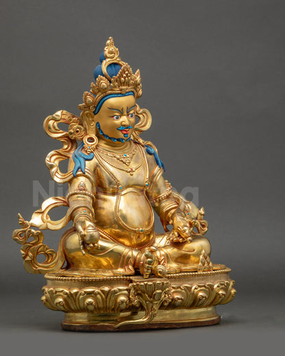 Right view side Dzambhala statue on lotus seat with radiant gold fire-gilded base