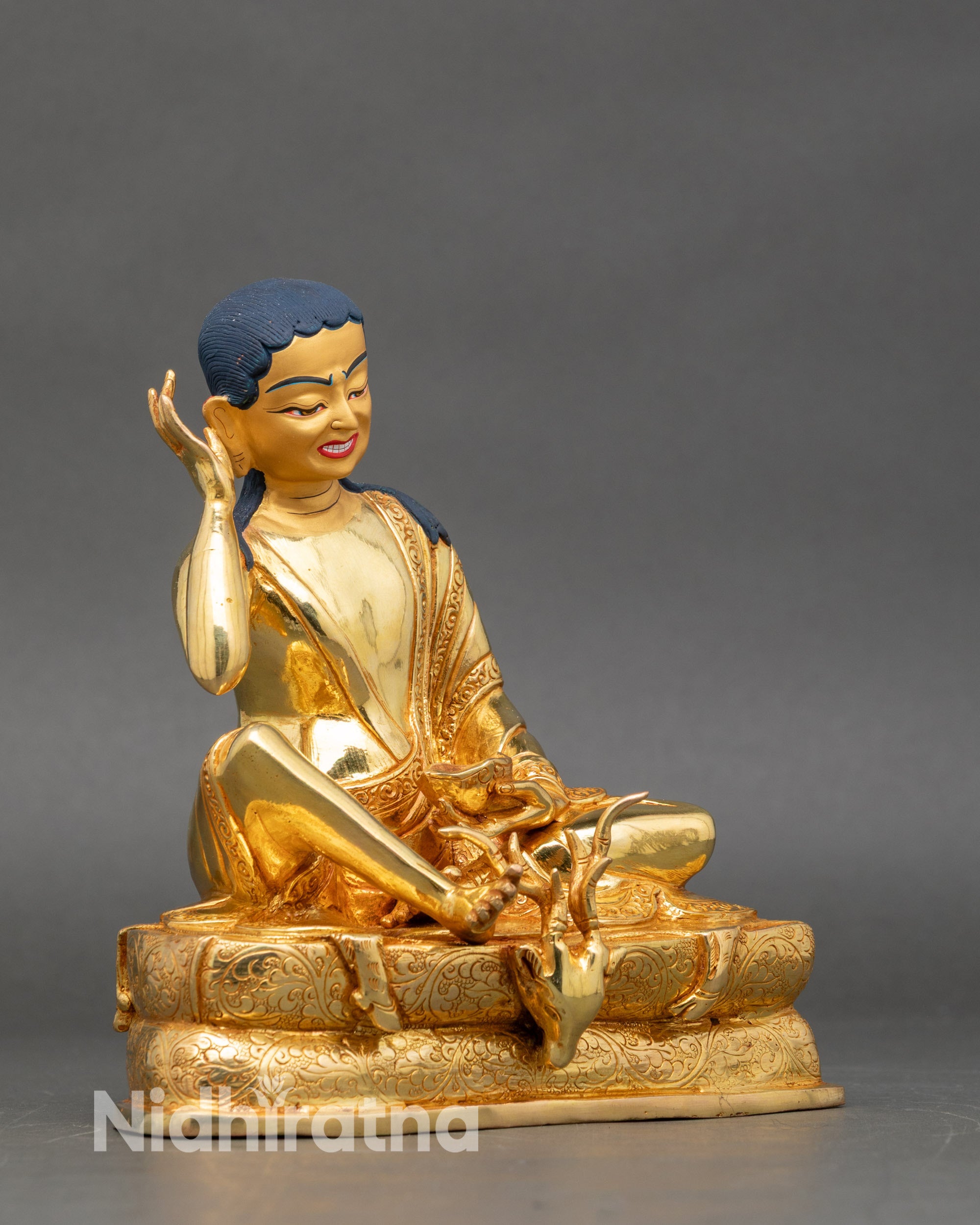 Right view side – Right profile of Milarepa statue with kapala and detailed pedestal engravings