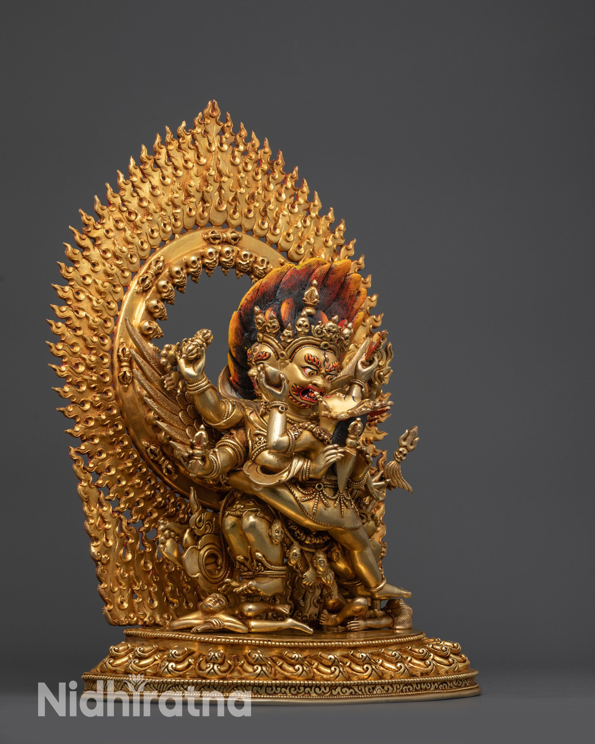 Right view side Vajrakilaya idol with six arms holding Phurba, bell, trident, and rosary

