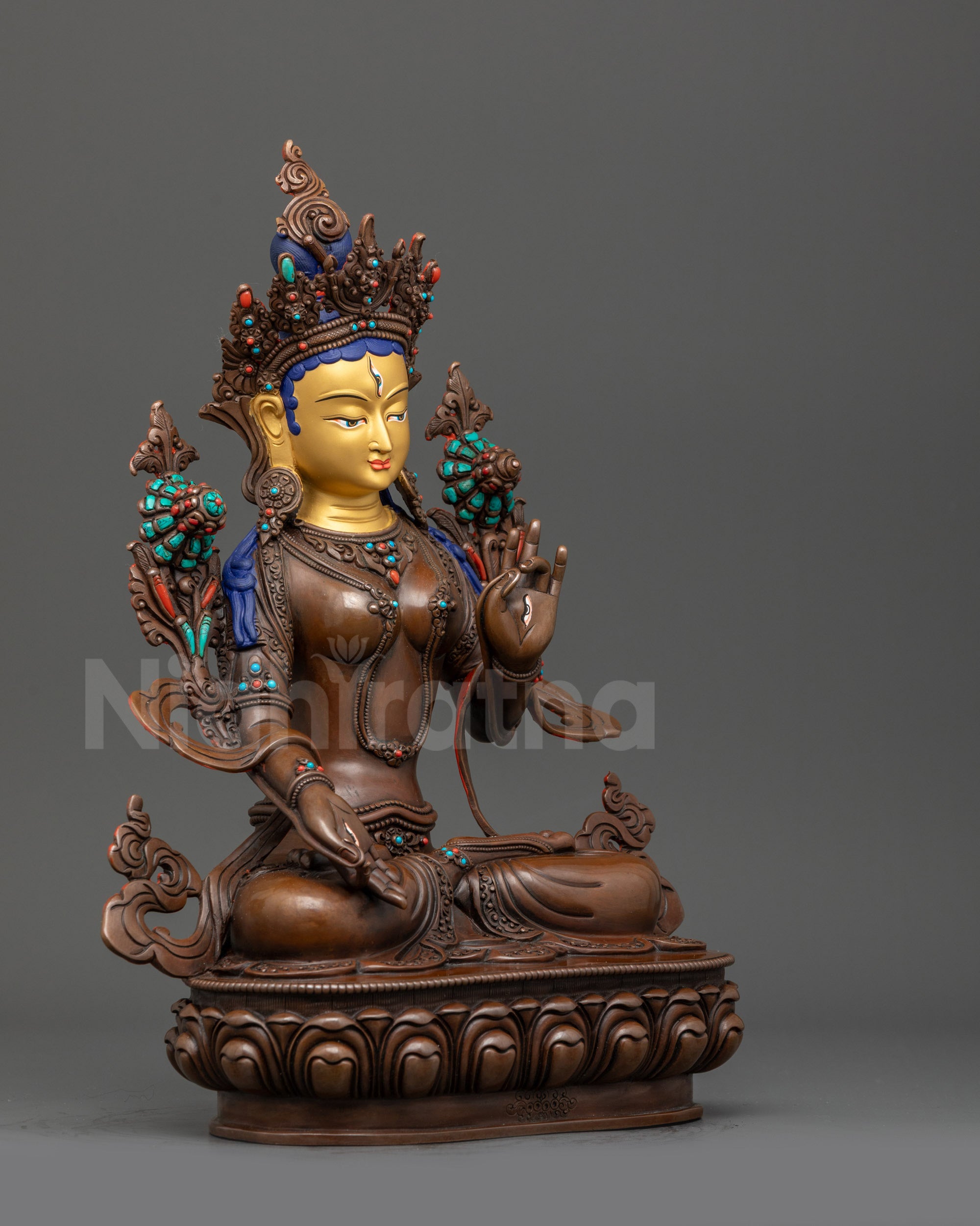 Right view side White Tara oxidized statue holding utpala flower in Varada mudra
