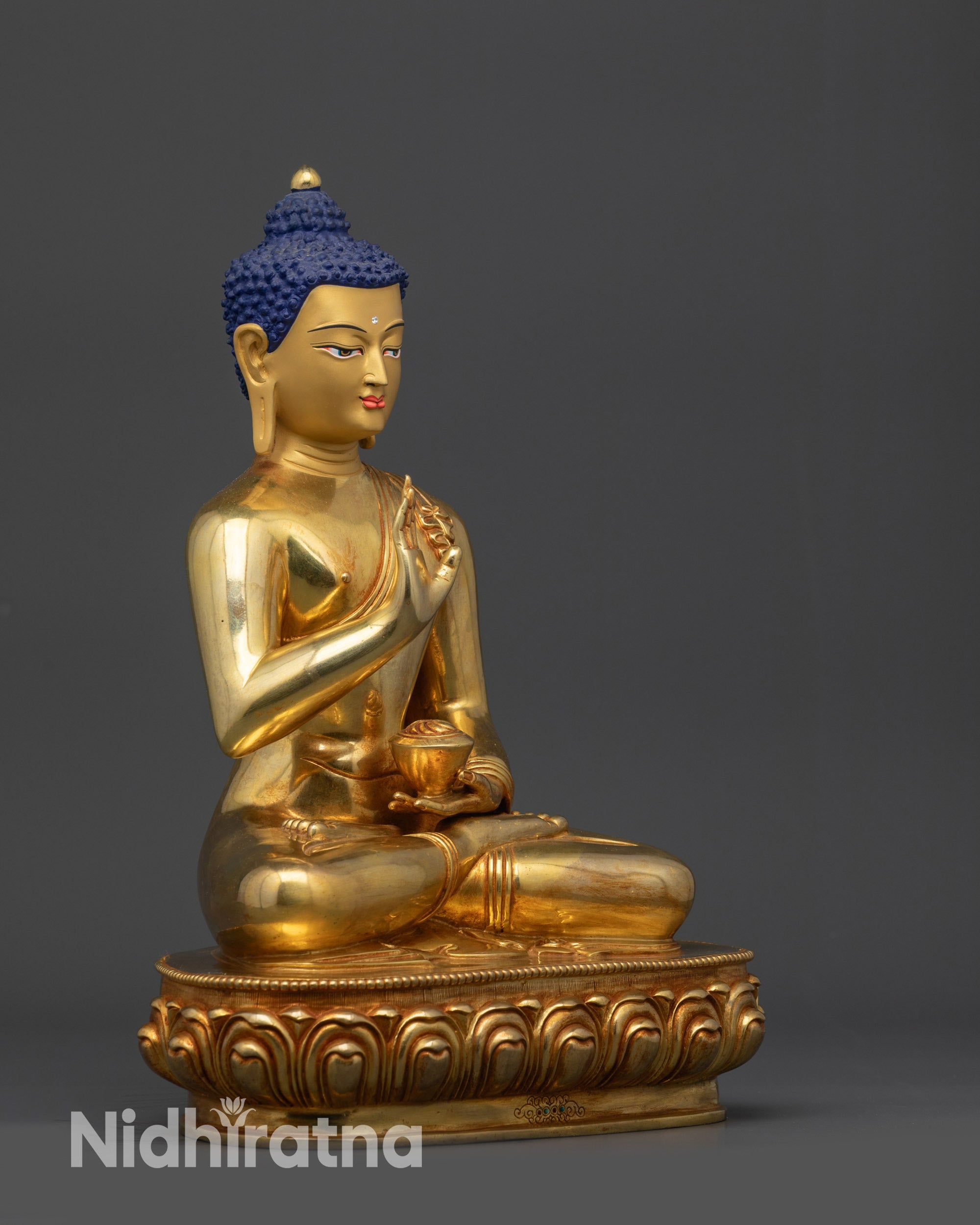 Right view side of Amoghasiddhi Buddha statue seated on lotus with bowl and mudra
