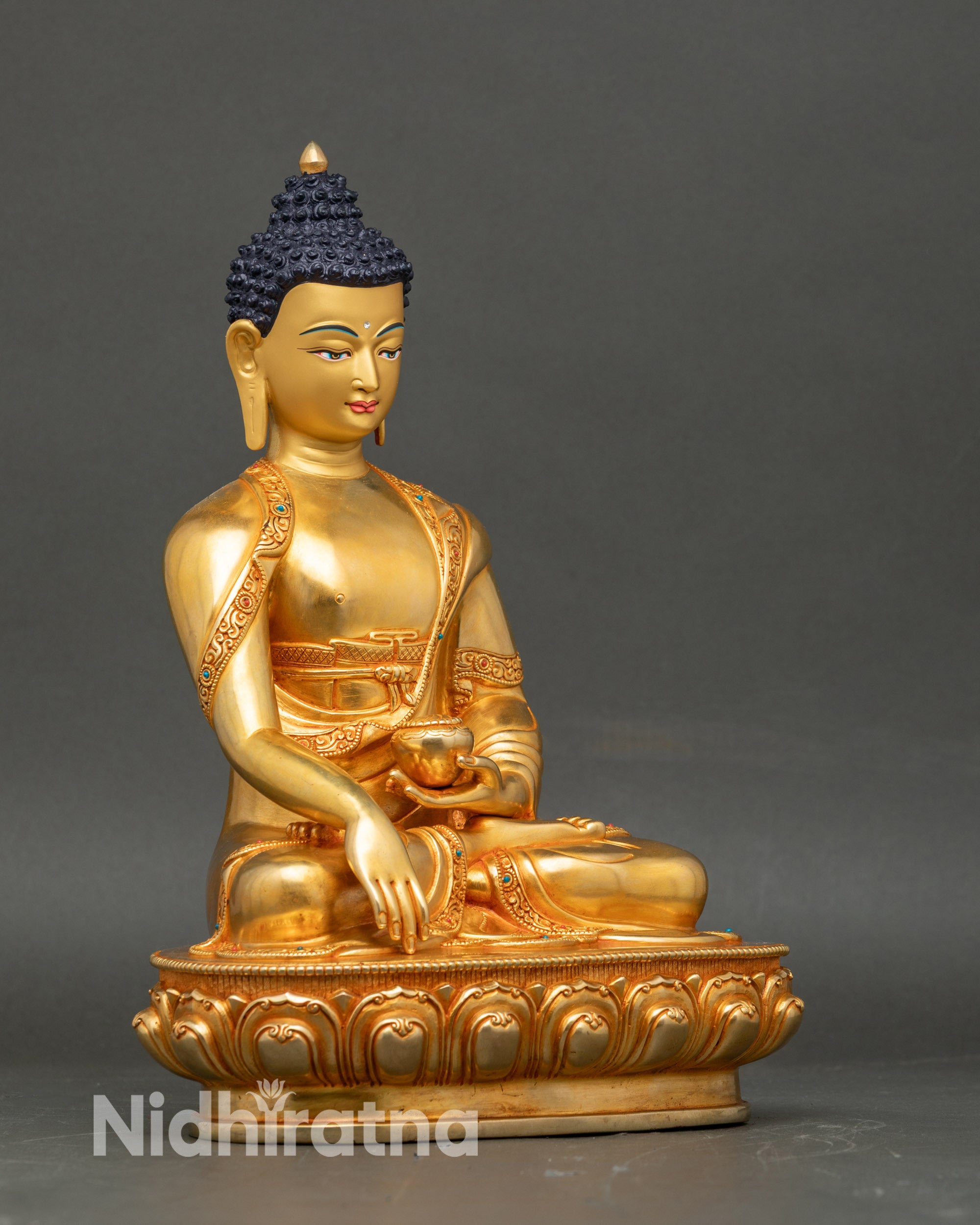 Right view side of Gautam Buddha statue, seated in lotus pose, gold fire-gilded