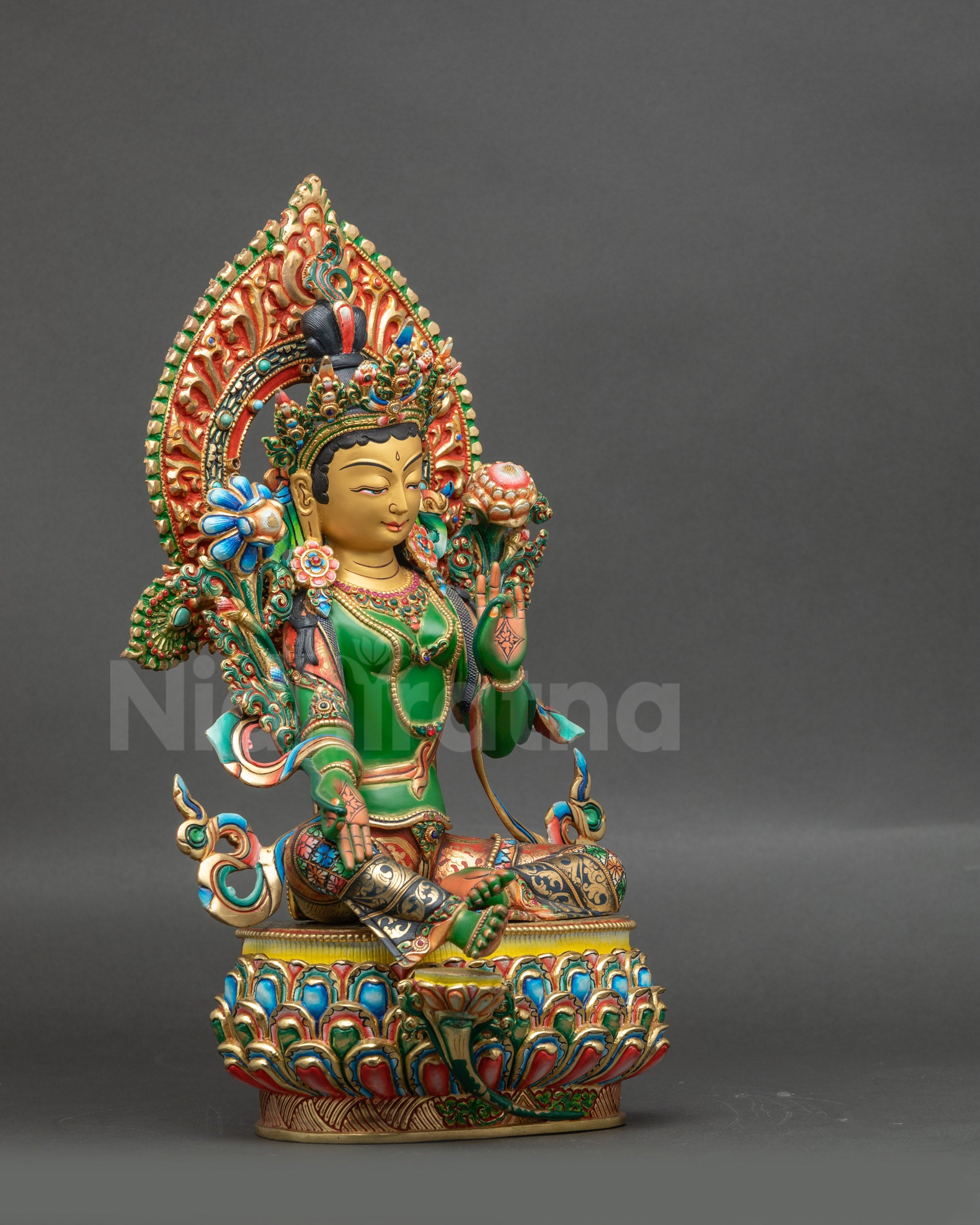 Right view side of Green Tara Statue showing lotus seat and intricate painted copper details