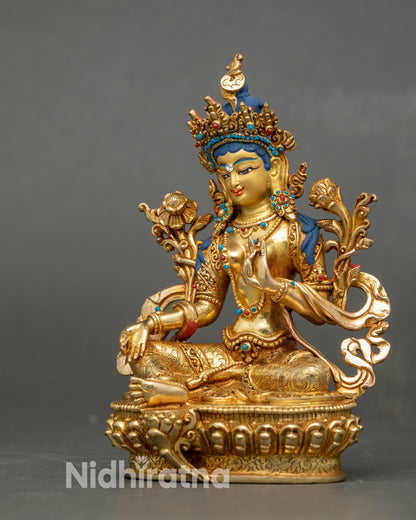 Right view side of Green Tara statue, Varada and Vitarka mudras clearly shown