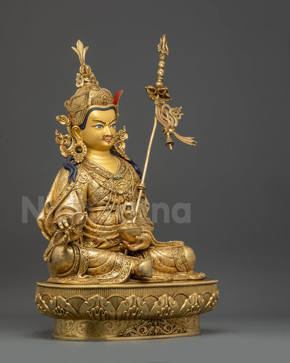 Right view side of Guru Rinpoche statue highlighting swirling garments and sacred motifs
