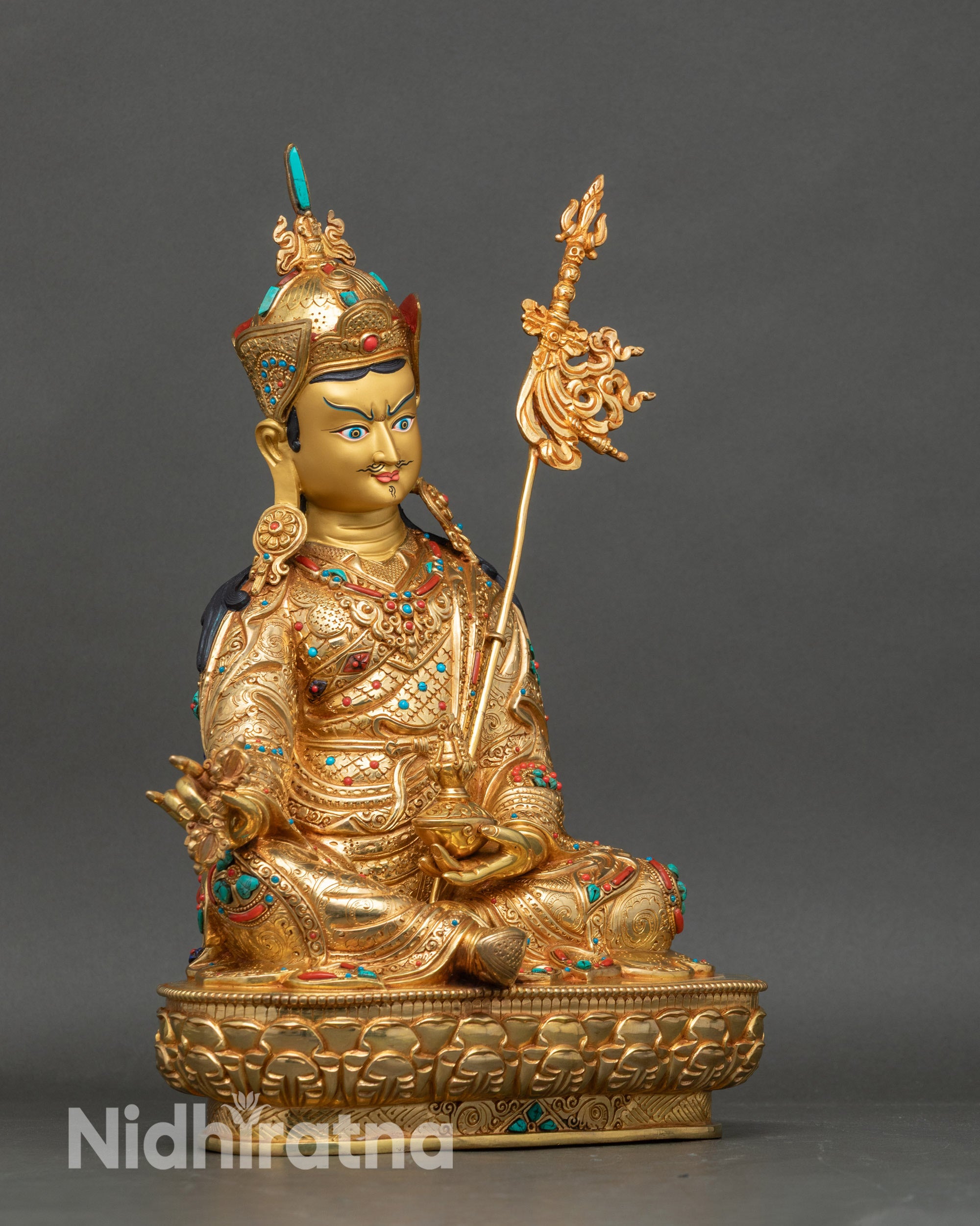 Right view side of Guru Rinpoche statue with lotus pedestal and gold embellishments