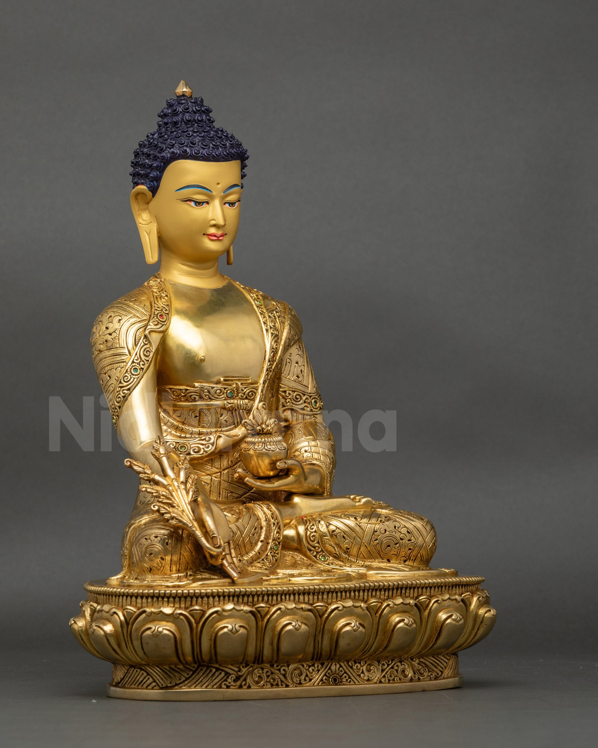 Right view side of Medicine Buddha statue showing lotus seat and copper fire-gilding