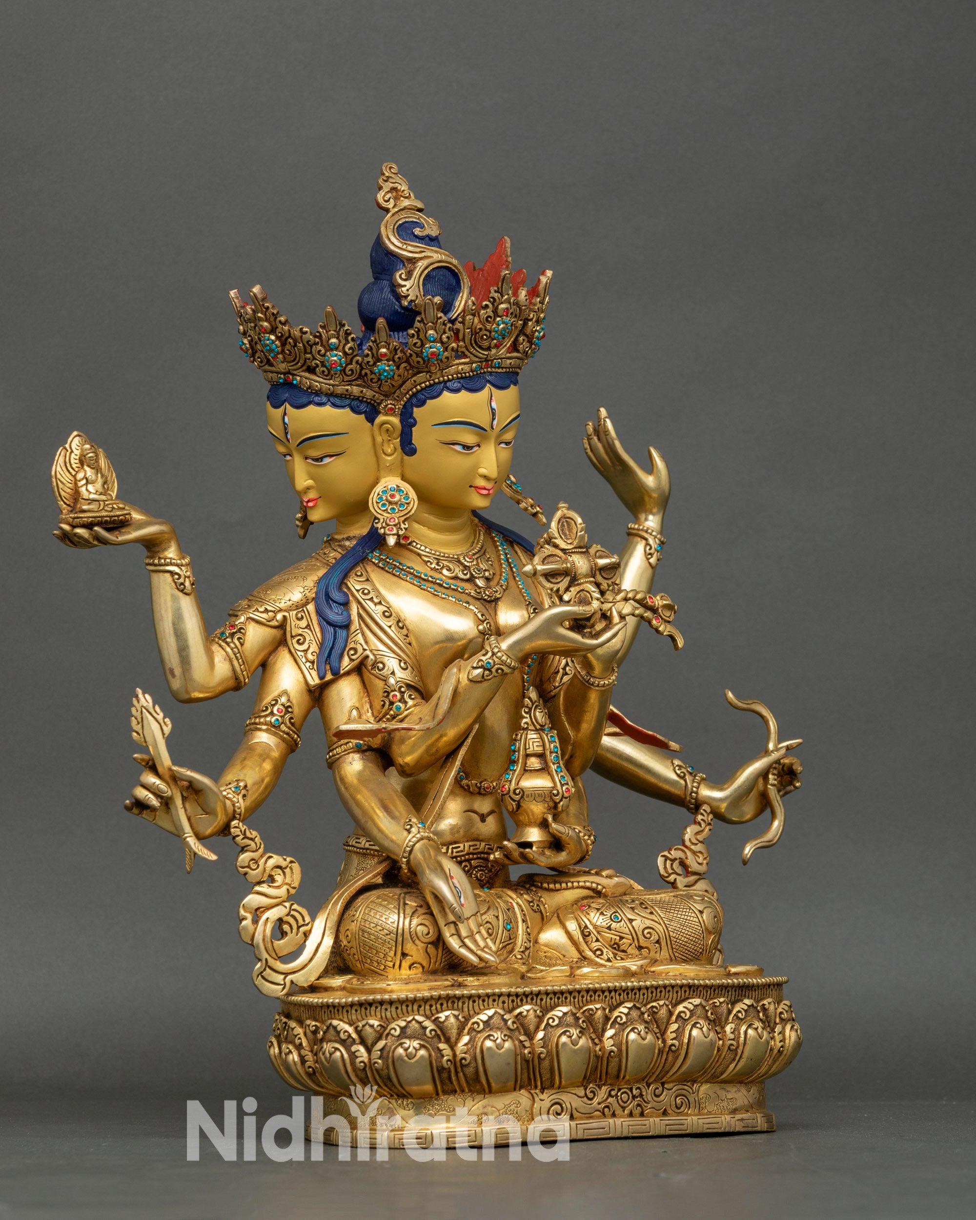 Right view side of Namgyalma statue with vishva dorje, sacred vase, and bow details
