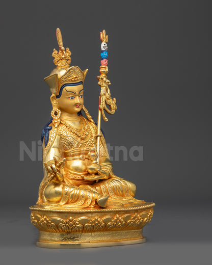 Right view side of Nepalese Guru Rinpoche statue with intricate swirling garments