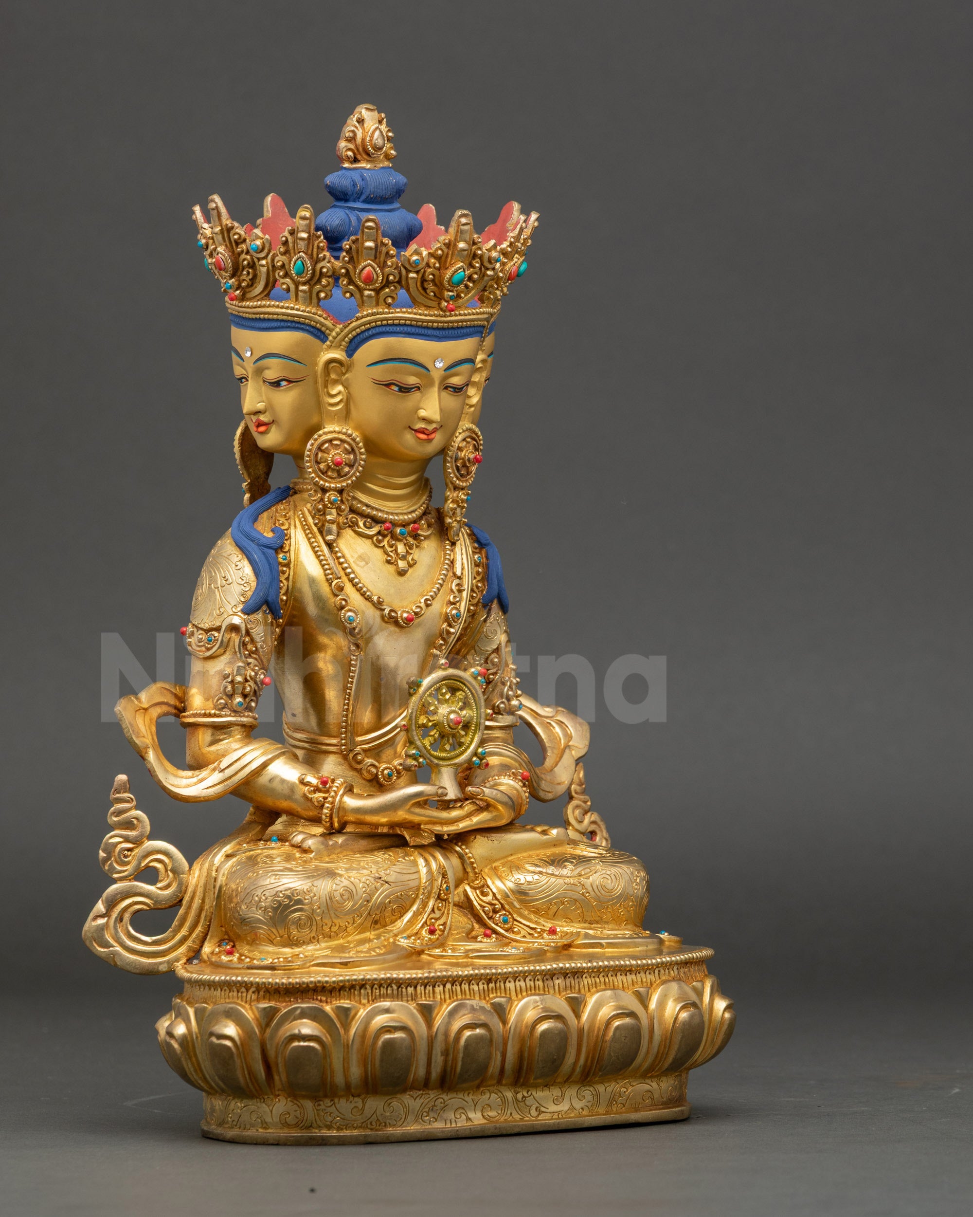 Right view side of Nepalese Vairocana Buddha statue holding Dharma Wheel in Dhyana mudra