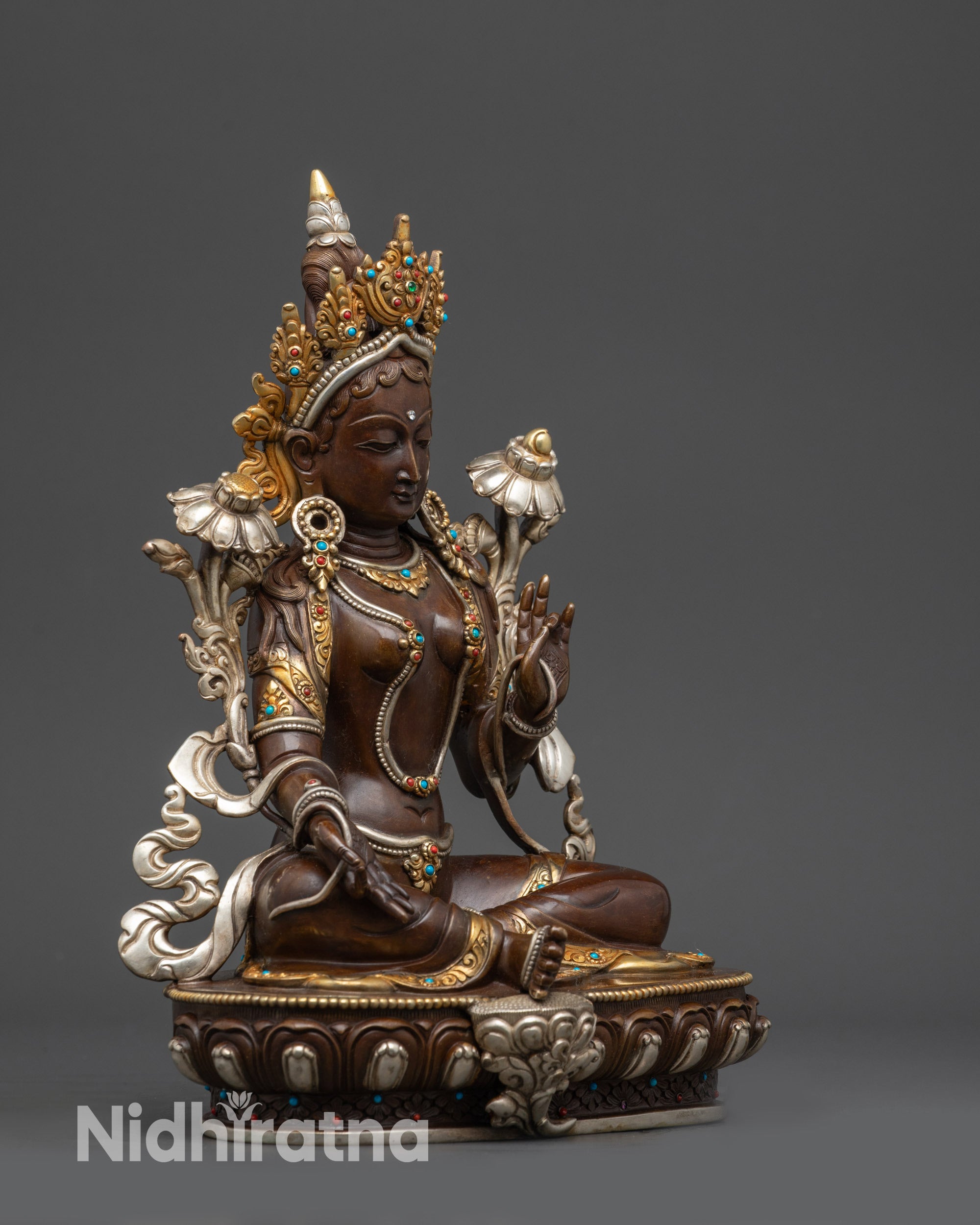 Right view side of Oxidized Green Tara Statue highlighting floral motifs and lotus pedestal