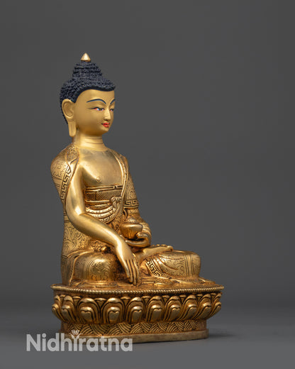 Right view side of Shakyamuni Buddha statue in lotus posture holding patra bowl
