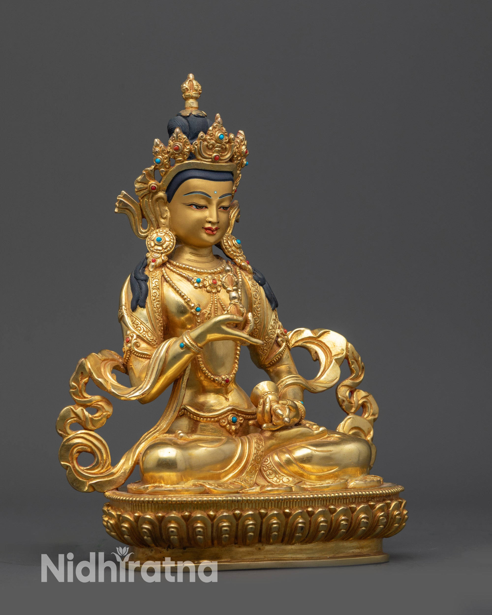 Right view side of Vajrasattva statue showing intricate lower garment and lotus seat