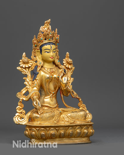 Right view side of White Tara statue displaying Varada and Vitarka mudra hands
