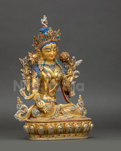 Right view side of White Tara statue seated on lotus with silver-plated crown