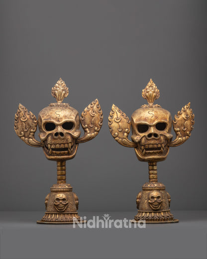 Front view of Citipati Skull Set with gold-plated crowns and copper base