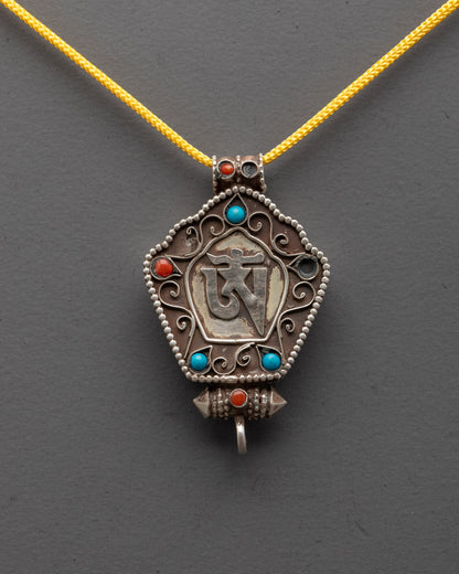 Close-up of Om Symbol Pendant showing silver Om and semi-precious stone details
