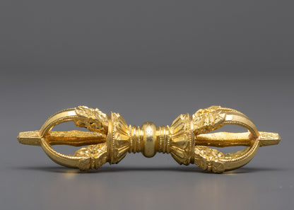 Angled composition of Nepalese Buddhist vajra and prayer bell set highlighting copper dorje and gold‑plated bell handle craftsmanshi
