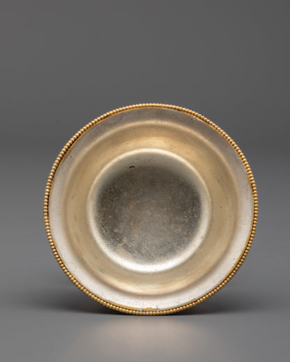 Tilted stacked bowls showing gold filigree patterns and semi-precious stone accents