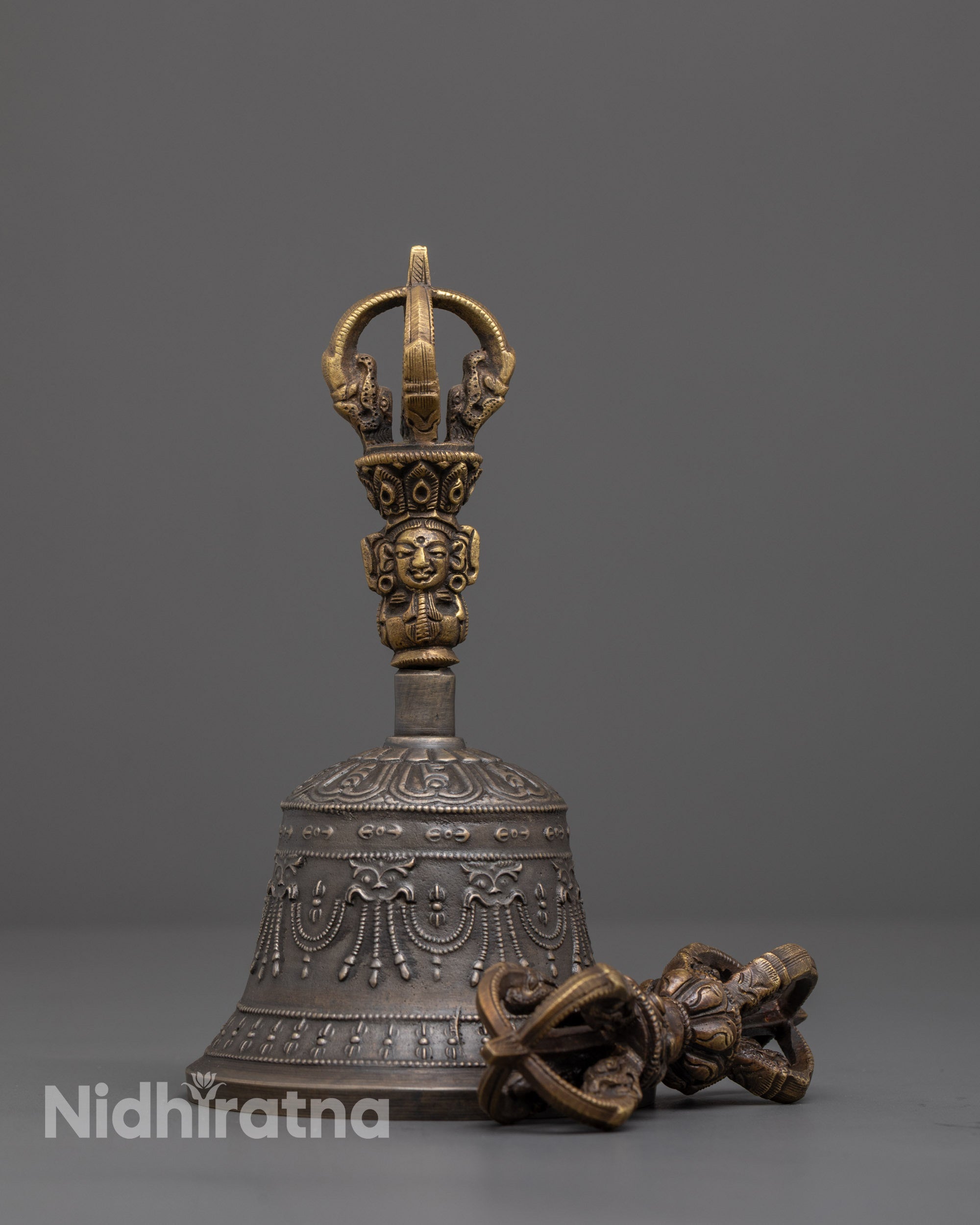 front view of handcrafted vajra and bell set with deity handle for tibetan rituals