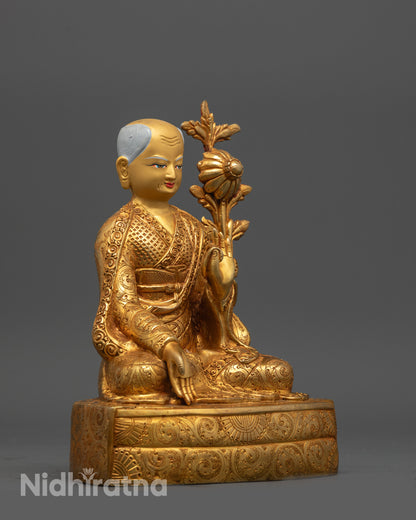 Sachen Kunga Nyingpo posing vitarka mudra with utpala flower, copper base detail