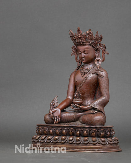 Sacred Bhaisajyaguru seated on double lotus base, antique oxidized Himalayan Buddhist art