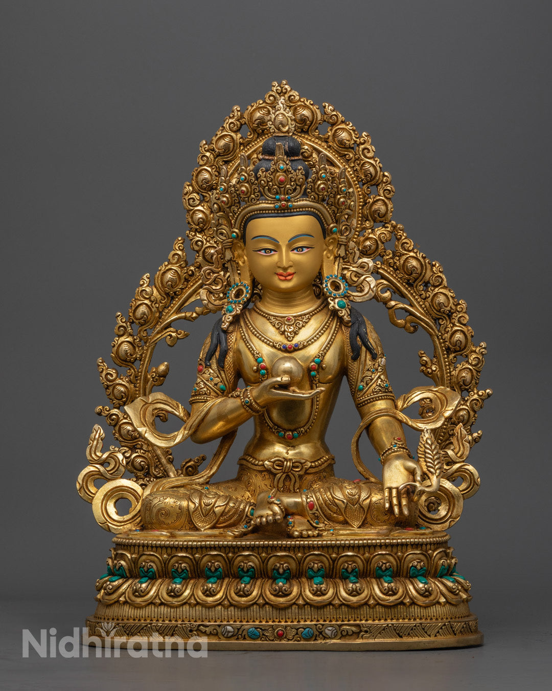 Sacred Ksitigarbha Statue handcrafted in Nepal with gold-gilded face and body, adorned with acrylic colors and semi-precious stones
