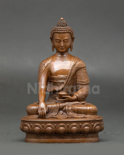 Sacred Shakyamuni Buddha Statue seated on a lotus throne, holding an alms bowl, a chemically oxidized Nepalese Buddhist sculpture