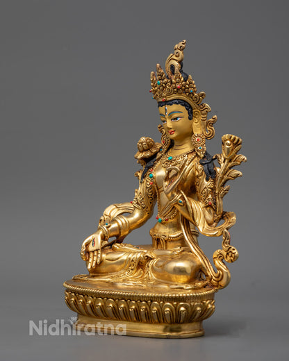 Sacred White Tara statue placed on a serene meditation altar, surrounded by candles and mala beads for spiritual practice.