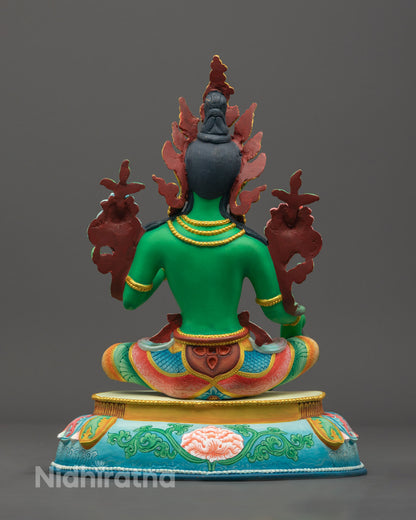 Sacred hollow chamber at base of Green Tara statue for storing mantras or relics, following Tibetan Buddhist traditions