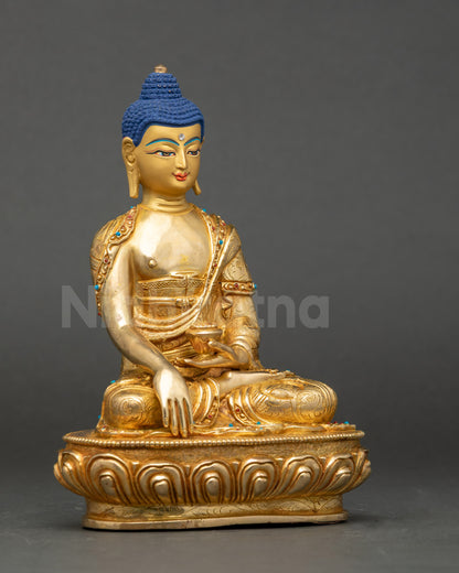 Sakyamuni Buddha face close up with 24K gold and semi-precious stones