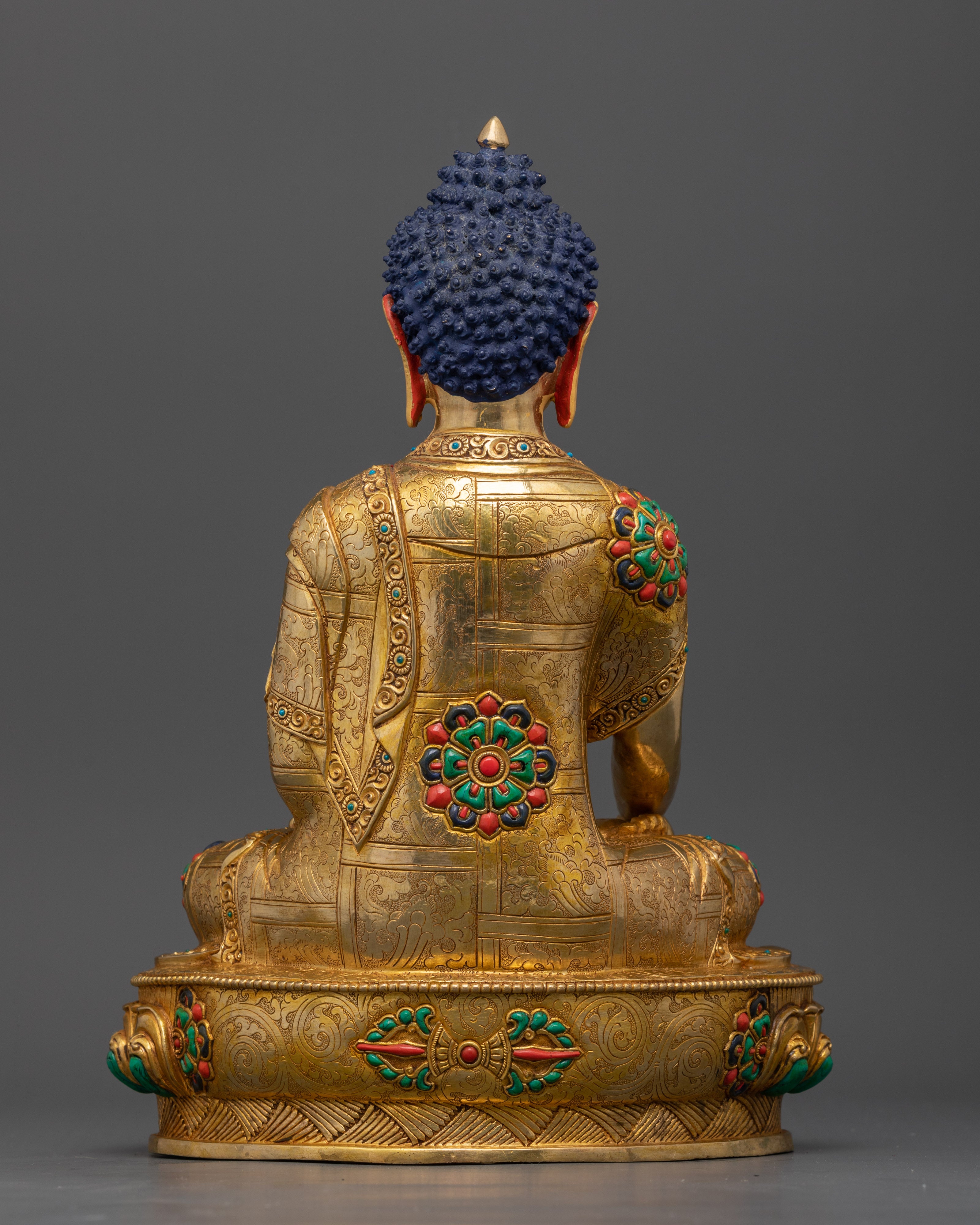 Sakyamuni Buddha statue full view, traditional Nepalese Buddhist icon with radiant gold finish