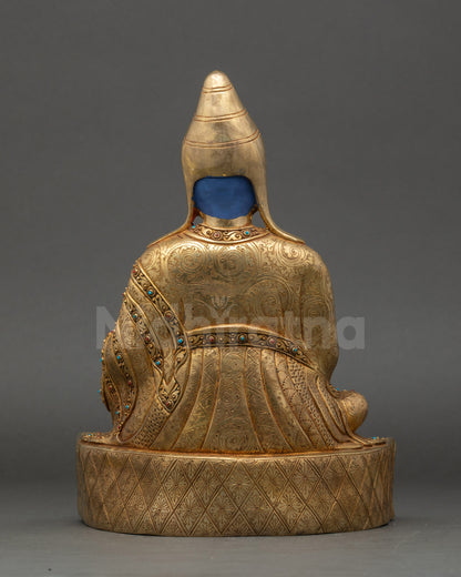 Santaraksita statue back view carved monastic robes and pedestal