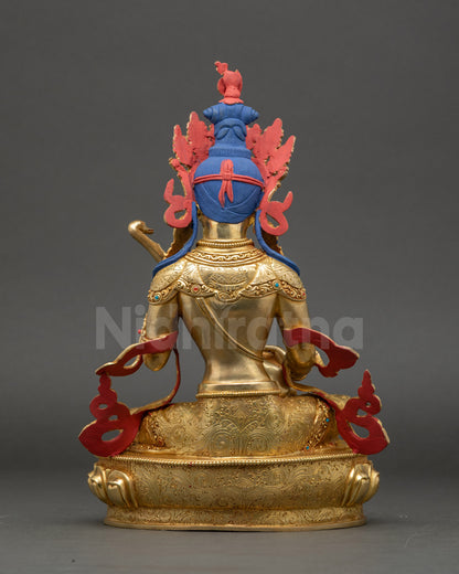 Saraswati statue back view revealing fire-gilded body and traditional Nepalese detailing