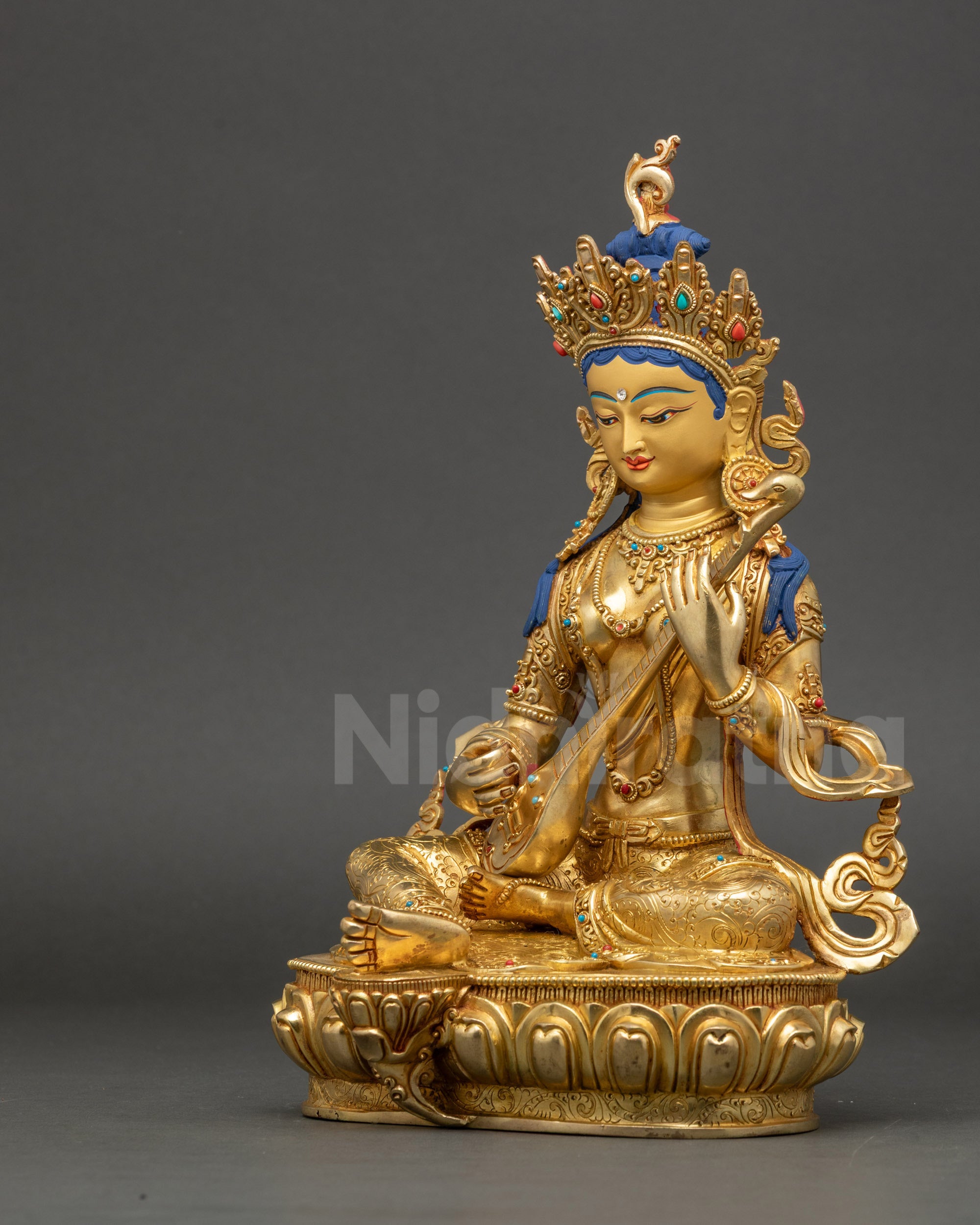 Saraswati statue left view side displaying veena, scriptures, and elegant craftsmanship