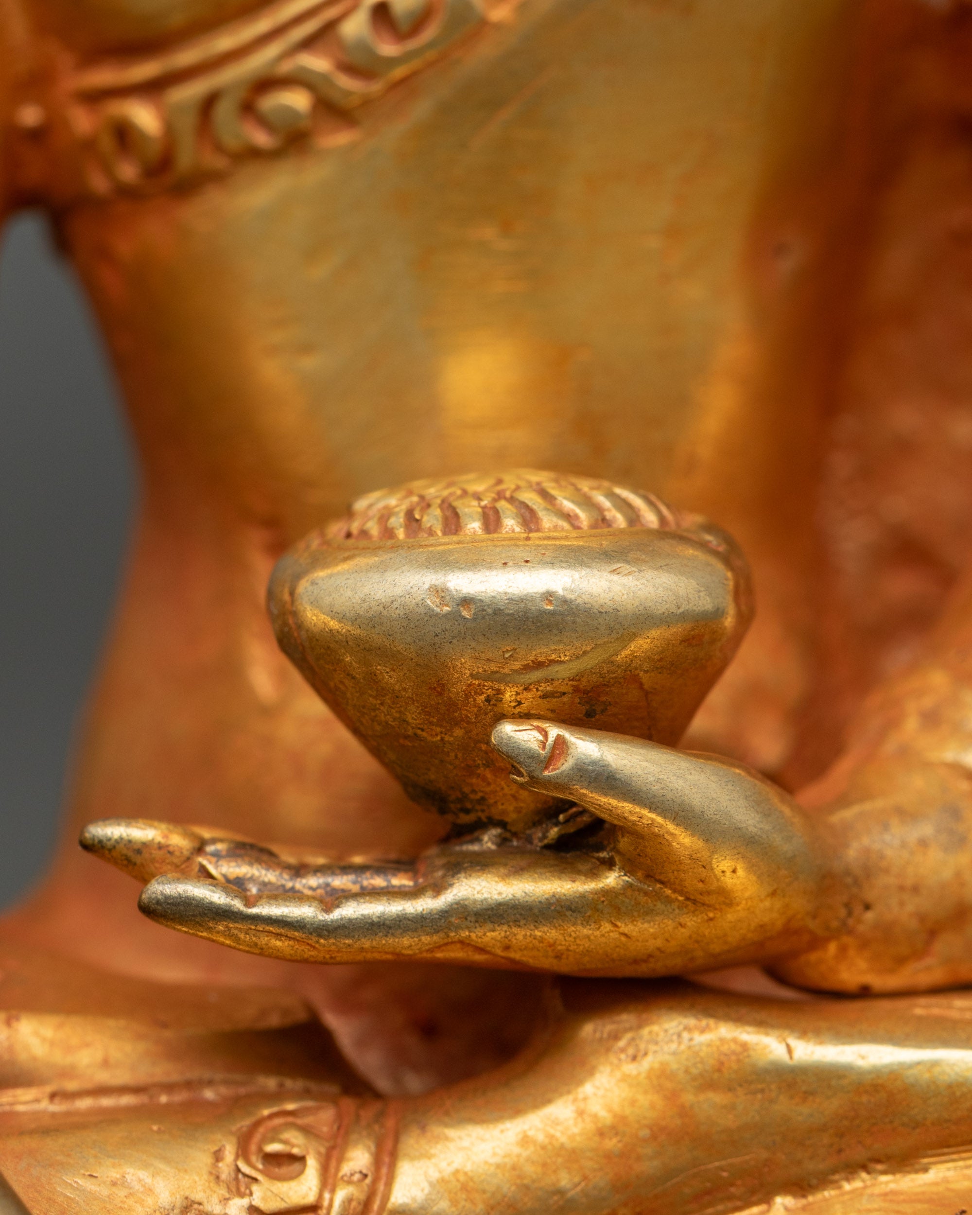Seated Shakyamuni Buddha holding alms bowl on lotus throne Nepal art