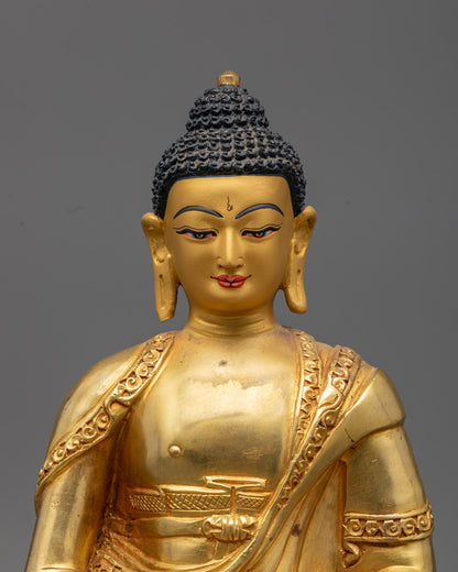 Serene golden face of Amitabha Buddha statue with intricate fire-gilded details and turquoise-inlaid urna, radiating infinite light