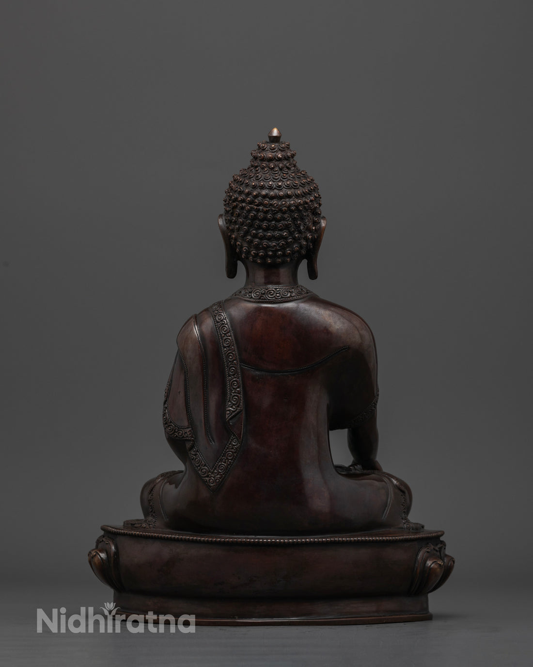 back view of shakyamuni buddha statue made of copper