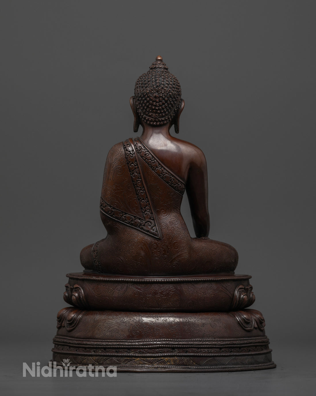 back profile of oxidized buddha statue