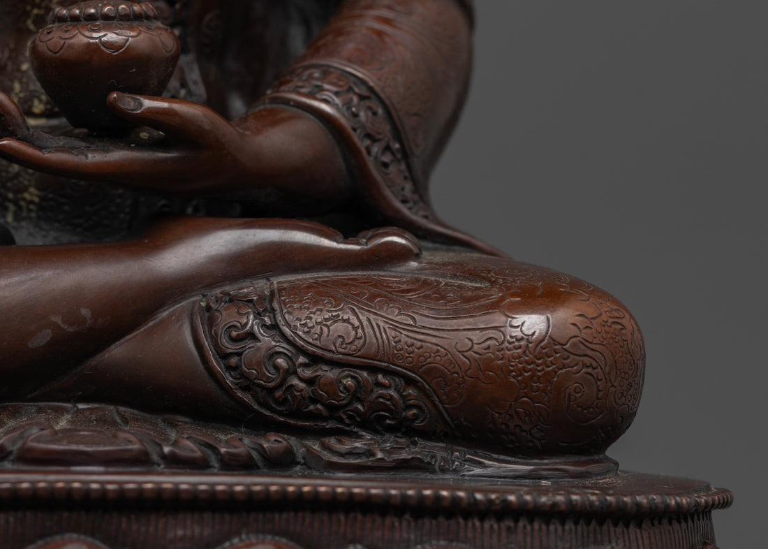 crossed leg of oxidized buddha statue