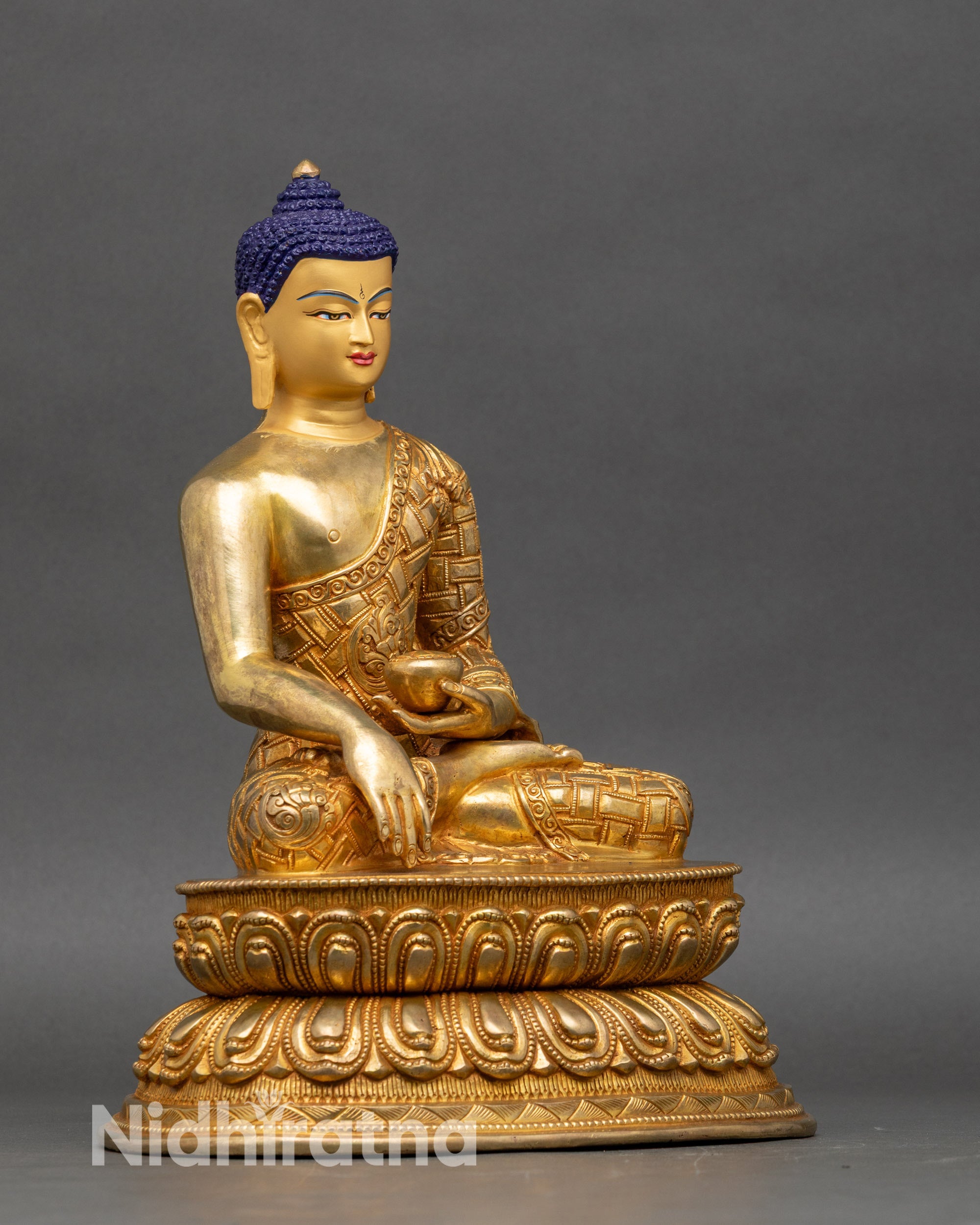 Right side view of Shakyamuni Buddha statue, fire-gilded copper, intricate robes, lotus seat, Nepalese craftsmanship