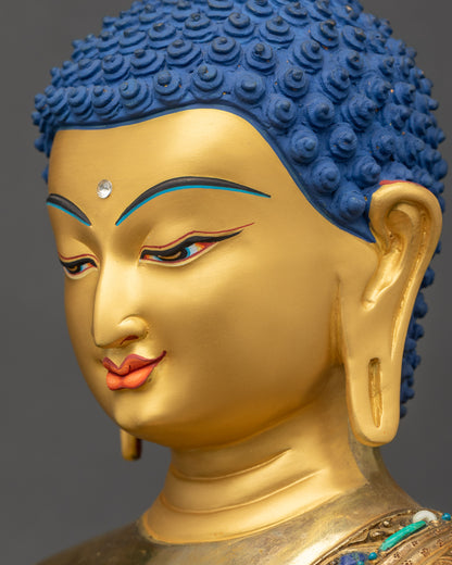 Close-up of Shakyamuni Buddha statue’s face from side highlighting serene expression