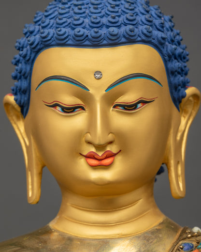 Detailed close-up of Shakyamuni Buddha gold-painted face showing tranquil expression
