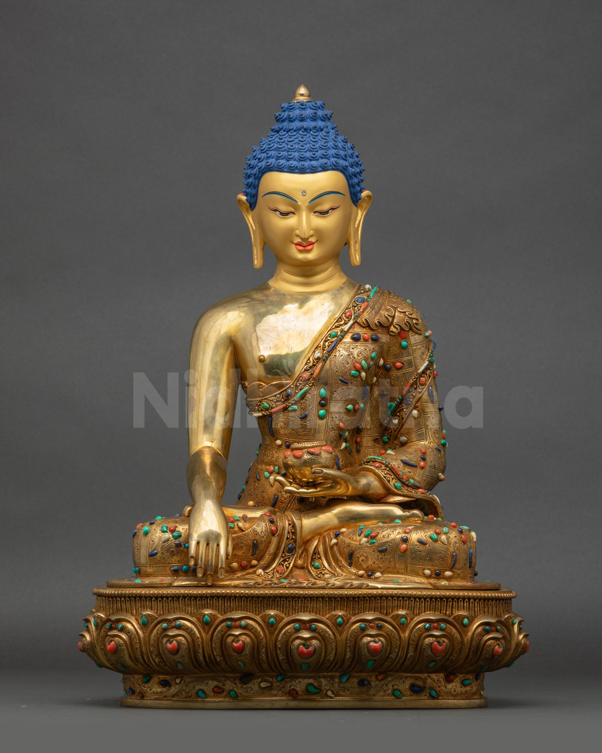 Front view of handcrafted Shakyamuni Buddha statue with gold-gilded base and lotus seat