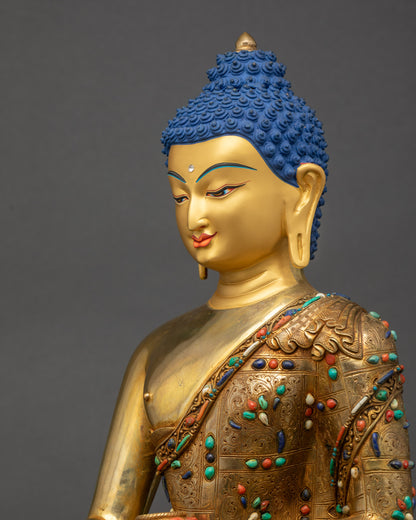 Side close-up of Shakyamuni Buddha statue showing intricate robe patterns and craftsmanship