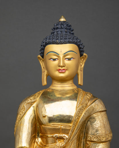 Shakyamuni Buddha Statue close-up, intricate robes and hand-carved details in gold