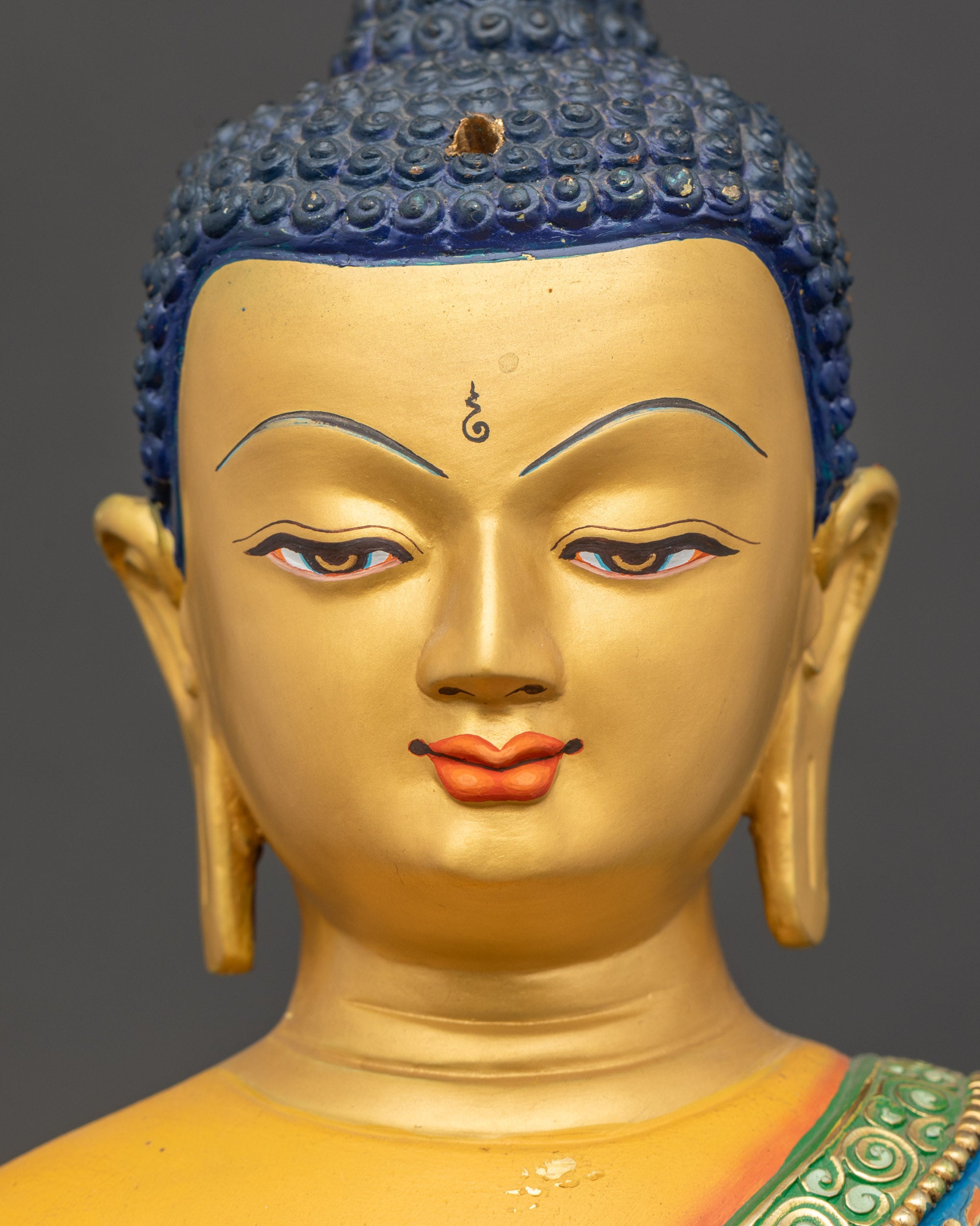 Shakyamuni Buddha Statue detailed face close up gold-gilded serene expression