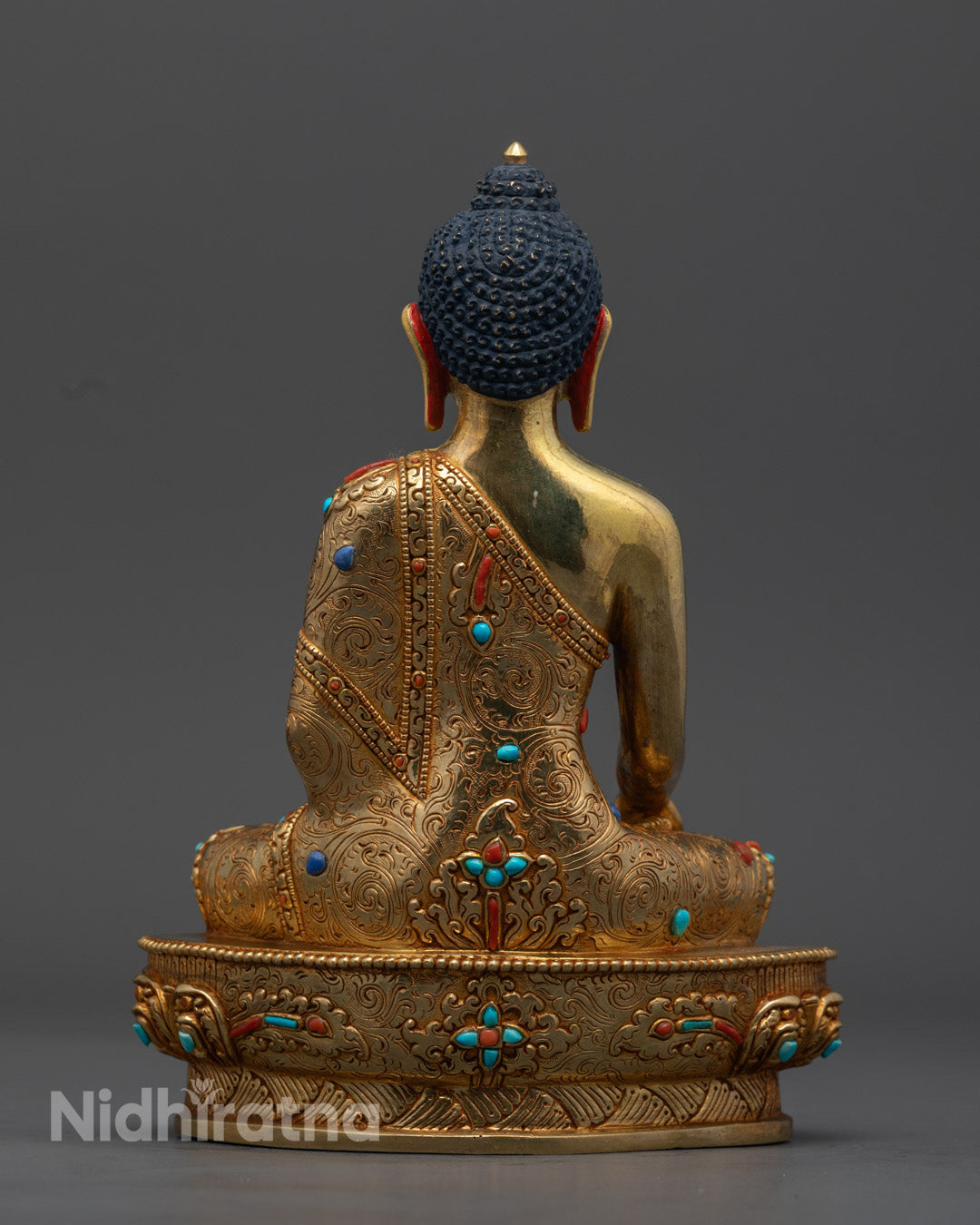 Shakyamuni Buddha Statue, emphasizing the 24K gold gilding and tranquil expression, symbolizing enlightenment and compassion