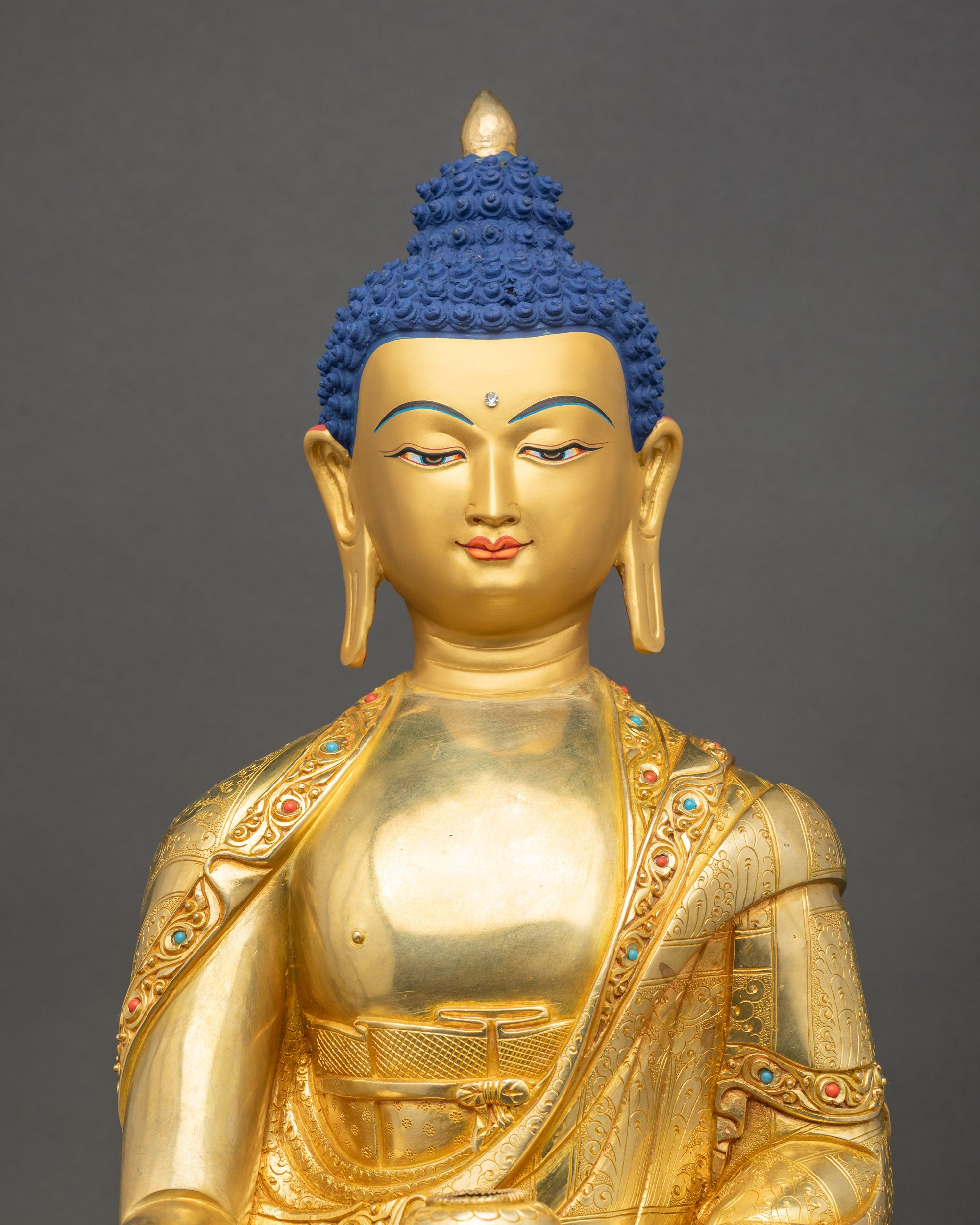 Shakyamuni Buddha close up meditation posture gold fire-gilded details