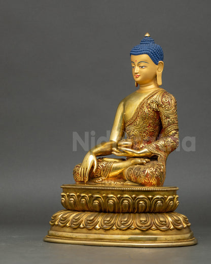 Shakyamuni Buddha copper statue side close up floral filigree robe details